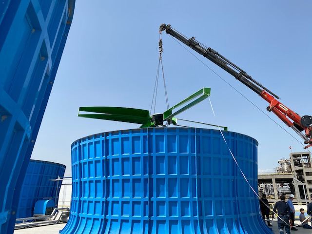 GT Green Fan being lifted onto a cooling tower at a polyester plant